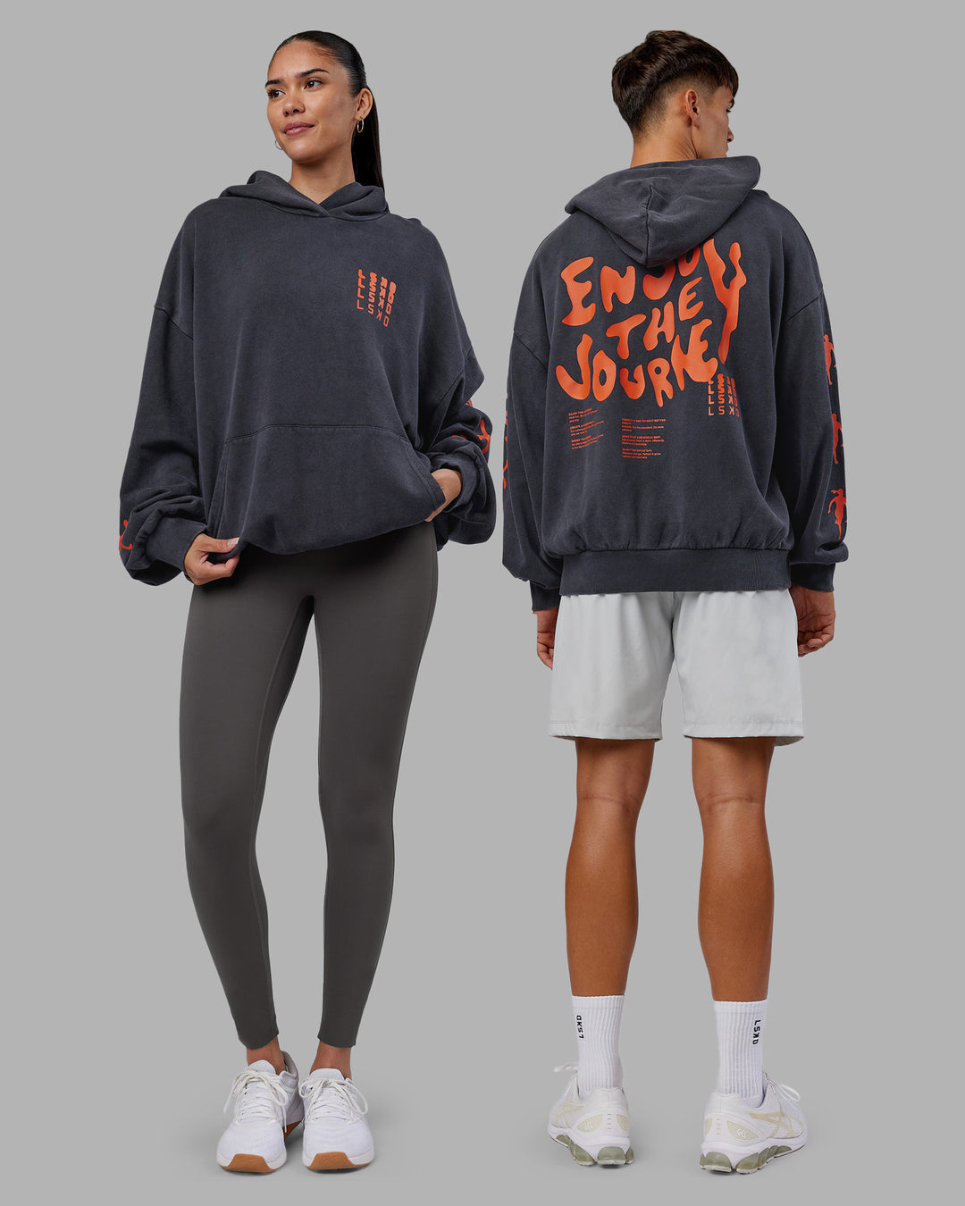 Duo wearing Journey Washed Unisex Oversize Hoodie - Black-Ultra Orange | Model:Both | Size:Duo - view 1
