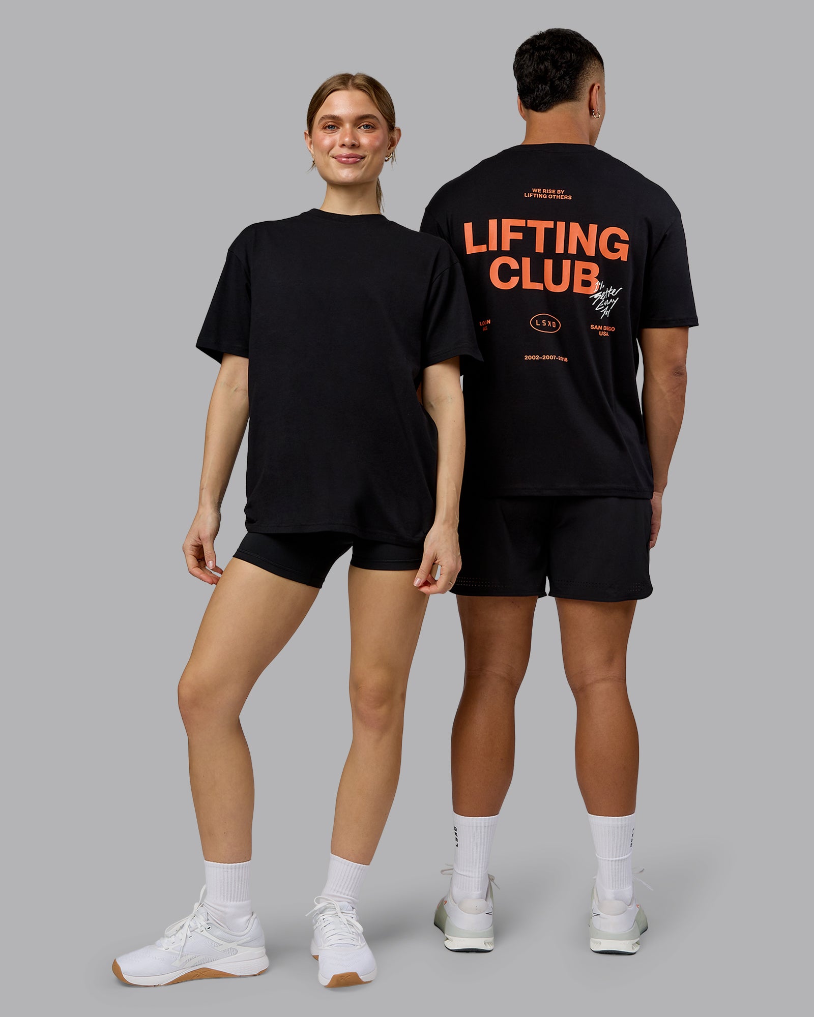 Duo wearing Lifting Club FLXCotton Tee Oversize - Black-Ultra Orange | Model:Both | Size:Duo