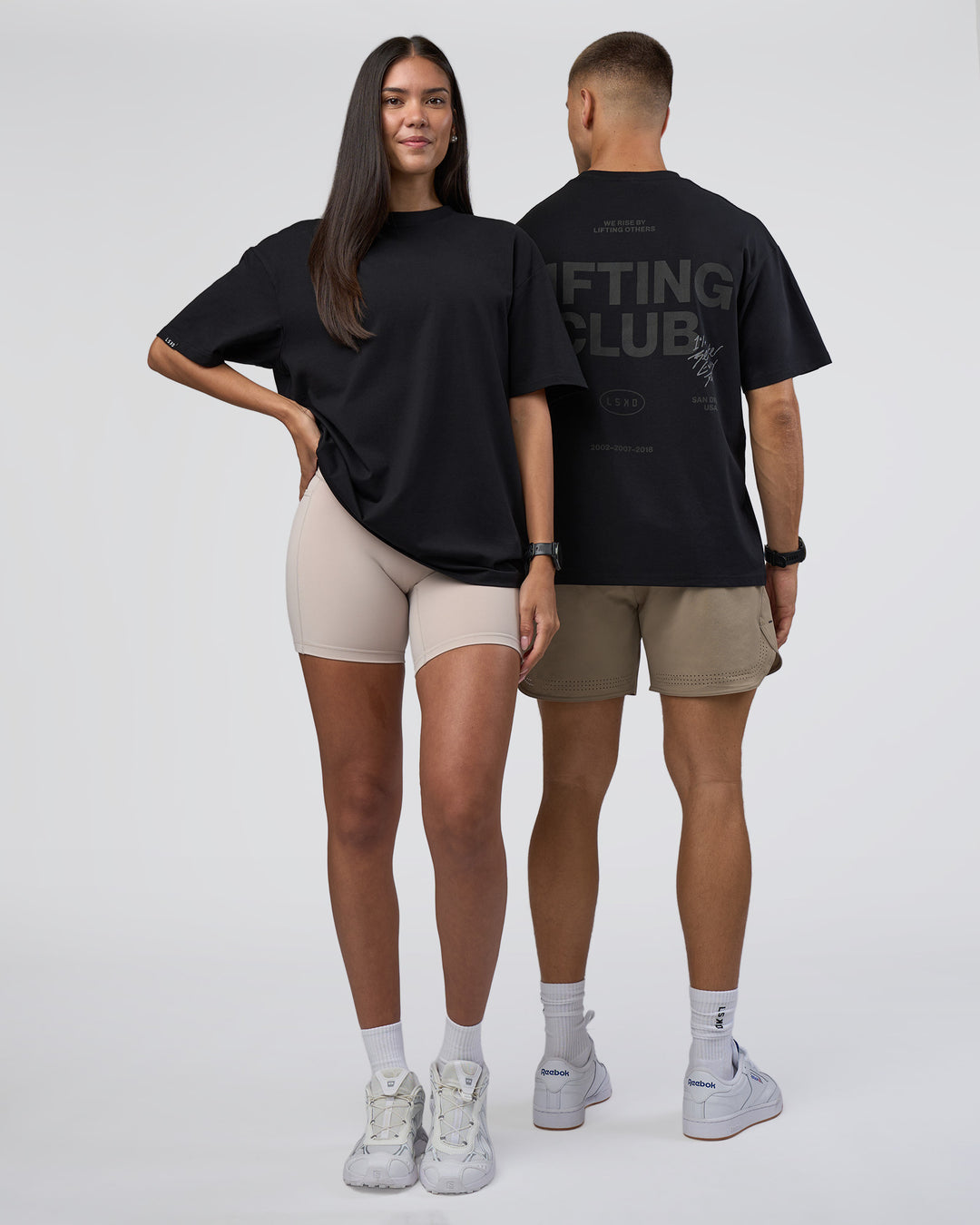 Duo wearing Lifting Club FLXCotton Tee Oversize - Black-Black | Model:Both | Size:Duo - view 1