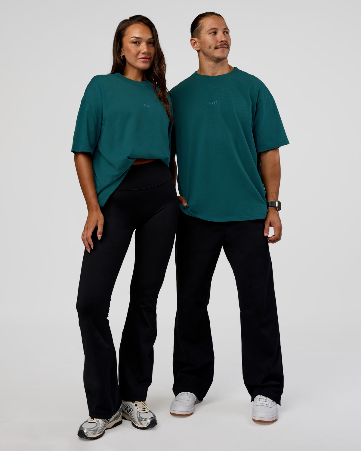 Duo wearing MVP 2.0 Oversized Tee - Transformative Teal | Model:Both | Size:Duo