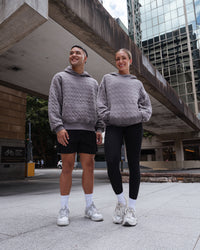 Duo wearing MVP Quilted Oversized Hoodie - Storm Front-Geometric | Model:Duo | Size:Duo | Thumbnail Index: 5
