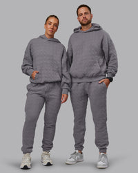 Duo wearing MVP Quilted Oversized Hoodie - Storm Front-Geometric | Model:Duo | Size:Duo | Thumbnail Index: 0
