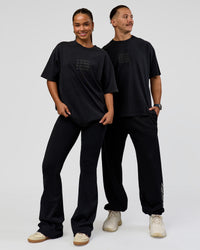 Duo wearing Move Fast Heavyweight Oversized Tee - Black Washed | Model:Both | Size:Duo | Thumbnail Index: 0