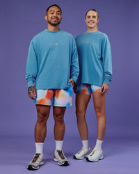 Duo wearing Our Journey Oversize Heavyweight FLXCotton Long Sleeve Tee - Azure Blue | Model:Both | Size:Duo | Thumbnail Index: 1