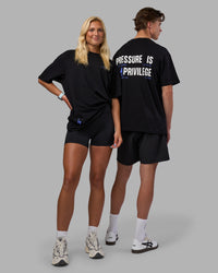 Duo wearing Pressure is a Privilege FLXCotton Oversized Tee - Black-Power Cobalt | Model:Both | Size:Duo | Thumbnail Index: 0
