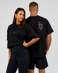 Duo wearing Pride Sticker Boxy Tee - Black | Model:Bianca | Size:S | Model:Albert | Size:M | Thumbnail Index: 0
