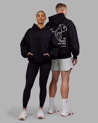 Duo wearing Rise & Lift Hoodie Oversized - Black-White | Model:Both | Size:Duo | Thumbnail Index: 0