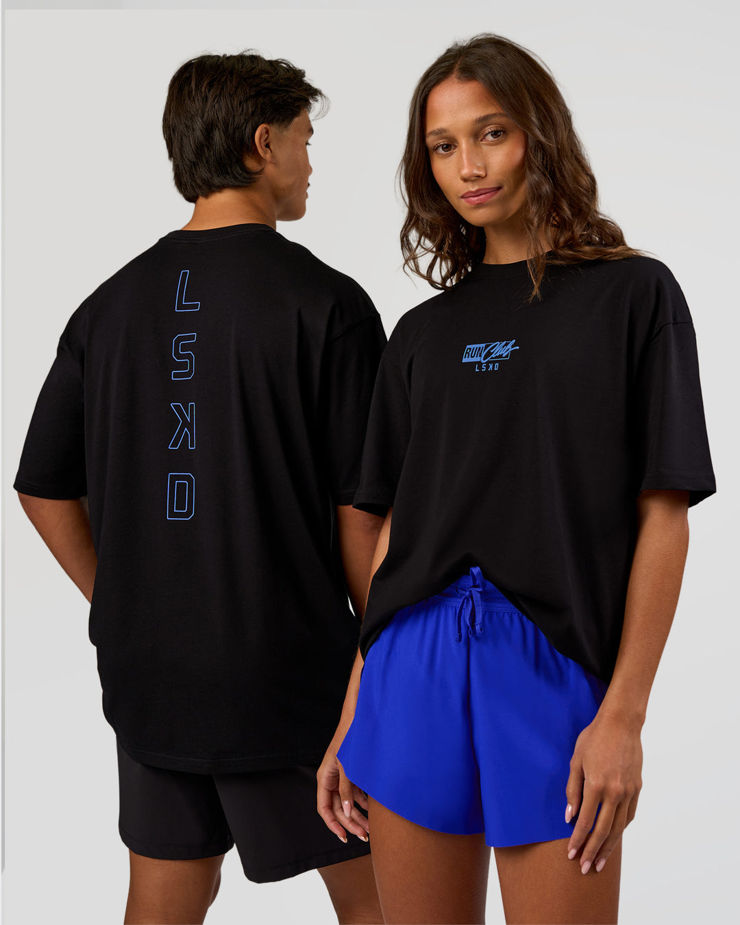 Duo wearing Run Club Script FLXCotton Oversized Tee - Black-Palace Blue | Model:Both | Size:Duo - view 1