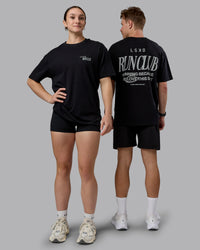 Duo wearing Run Love FLXCotton Oversized Tee - Black-Reflective | Model:Both | Size:Duo | Thumbnail Index: 0