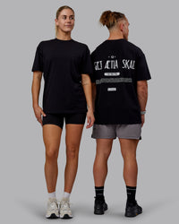 Duo wearing Sara GET ÆTLA SKAL Unisex FLXCotton Tee Oversize - Black-White | Thumbnail Index: 1