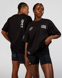 Duo wearing Static Grit Heavyweight Oversized Tee - Black-Alloy | Model:Both | Size:Duo | Thumbnail Index: 0