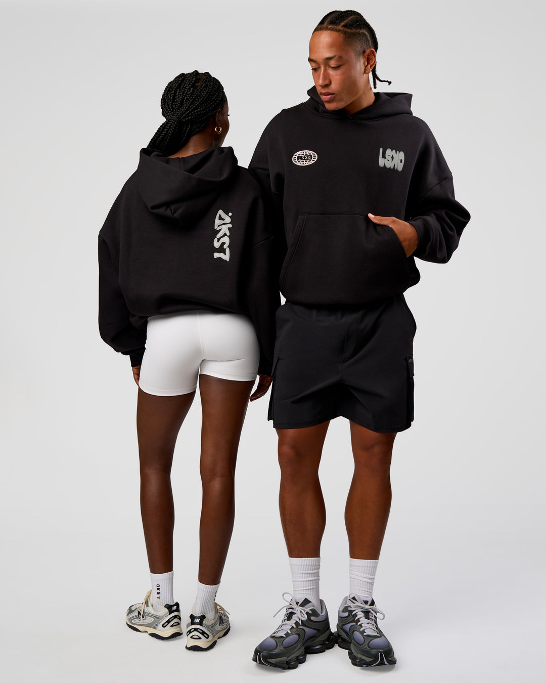 Duo wearing Static Grit Unisex Boxy Hoodie - Black-Alloy | Model:Both | Size:Duo - view 1