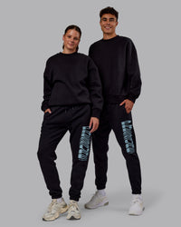 Duo wearing Static Track Pant - Black-Skyride | Model:Both | Size:Duo | Thumbnail Index: 3