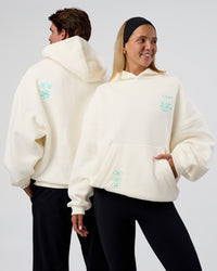 Duo wearing Sticker Unisex Oversized Hoodie - Off White-Jelly Mint | Model:Both | Size:Duo | Thumbnail Index: 0