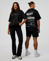 Duo wearing Trust The Process Heavyweight Unisex Oversized Tee - Black-White | Model:Both | Size:Duo | Thumbnail Index: 0