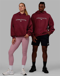 Duo wearing Unisex 1% Better Hoodie Oversize - Cranberry-White | Thumbnail Index: 0