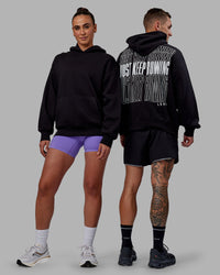 Duo wearing Unisex Keep on Running Hoodie Oversize - Black-White | Thumbnail Index: 0