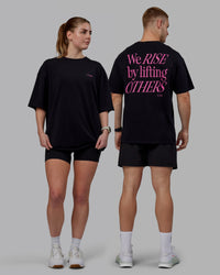 Duo wearing Unisex Lift-Up FLXCotton Tee Oversize - Black-Fuschia Pink | Thumbnail Index: 0