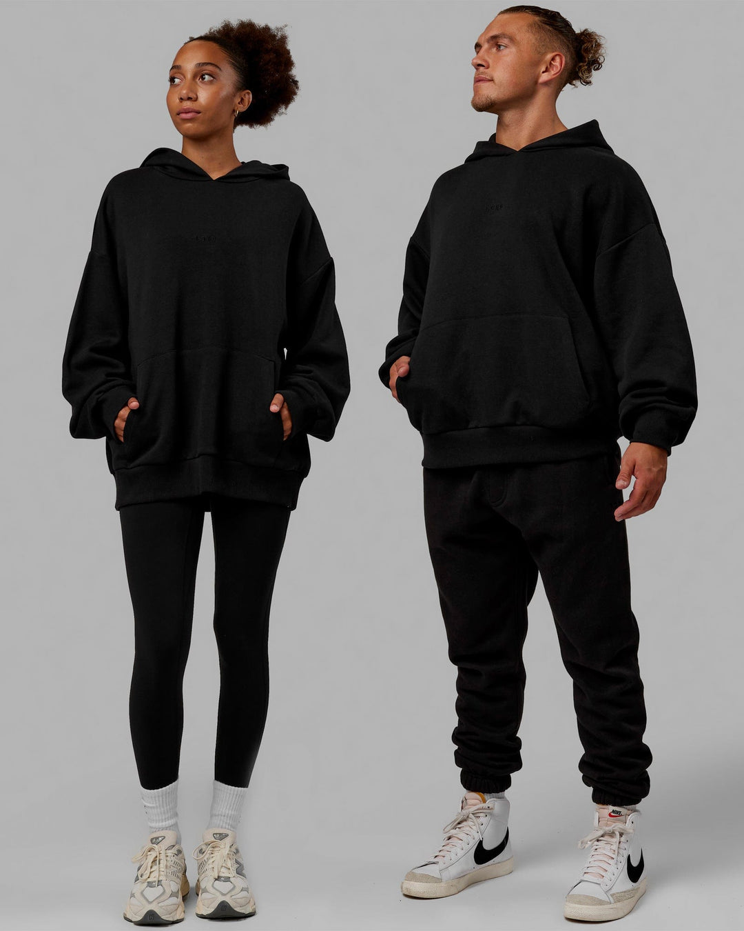 Duo wearing Unisex MVP Hoodie Oversize - Black - view 2