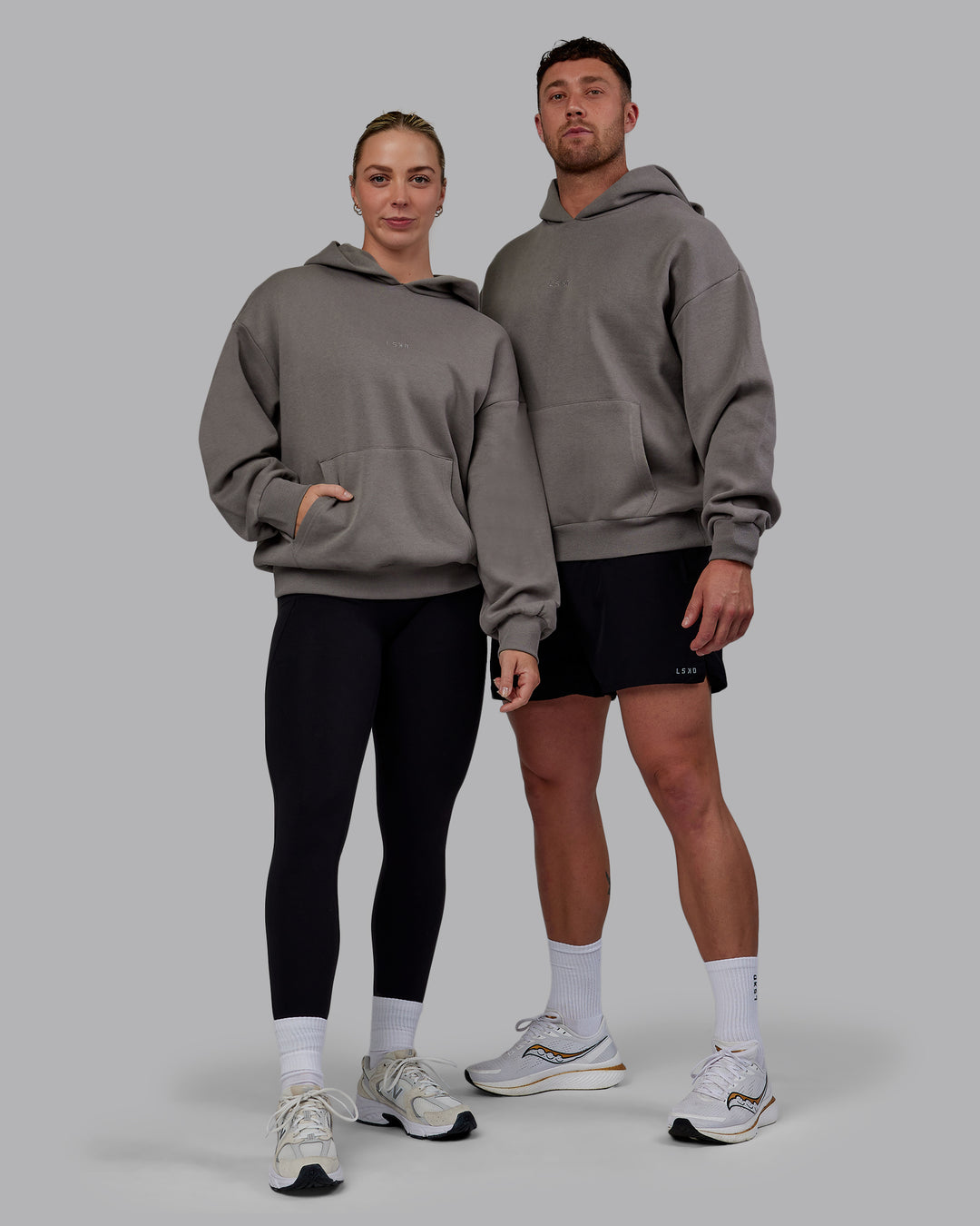 Duo wearing Unisex MVP Hoodie Oversize - Storm Front - view 1