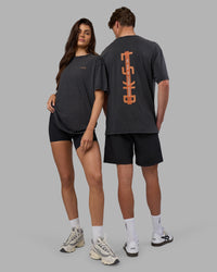 Duo wearing Unisex Strike Through FLXCotton Tee Oversize - Black Washed-Cantaloupe | Model:Both | Size:Duo | Thumbnail Index: 0