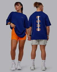 Duo wearing Unisex Strike Through FLXCotton Tee Oversize - Midnight Blue-Vibrant Orange | Thumbnail Index: 0