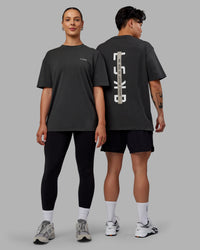 Duo wearing Unisex Strike Through FLXCotton Tee Oversize - Pirate Black-Black | Thumbnail Index: 0