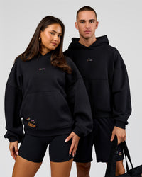 Duo wearing Pride Sticker Boxy Hoodie - Black | Model:Bianca | Size:XS | Model:Albert | Size:M | Thumbnail Index: 12