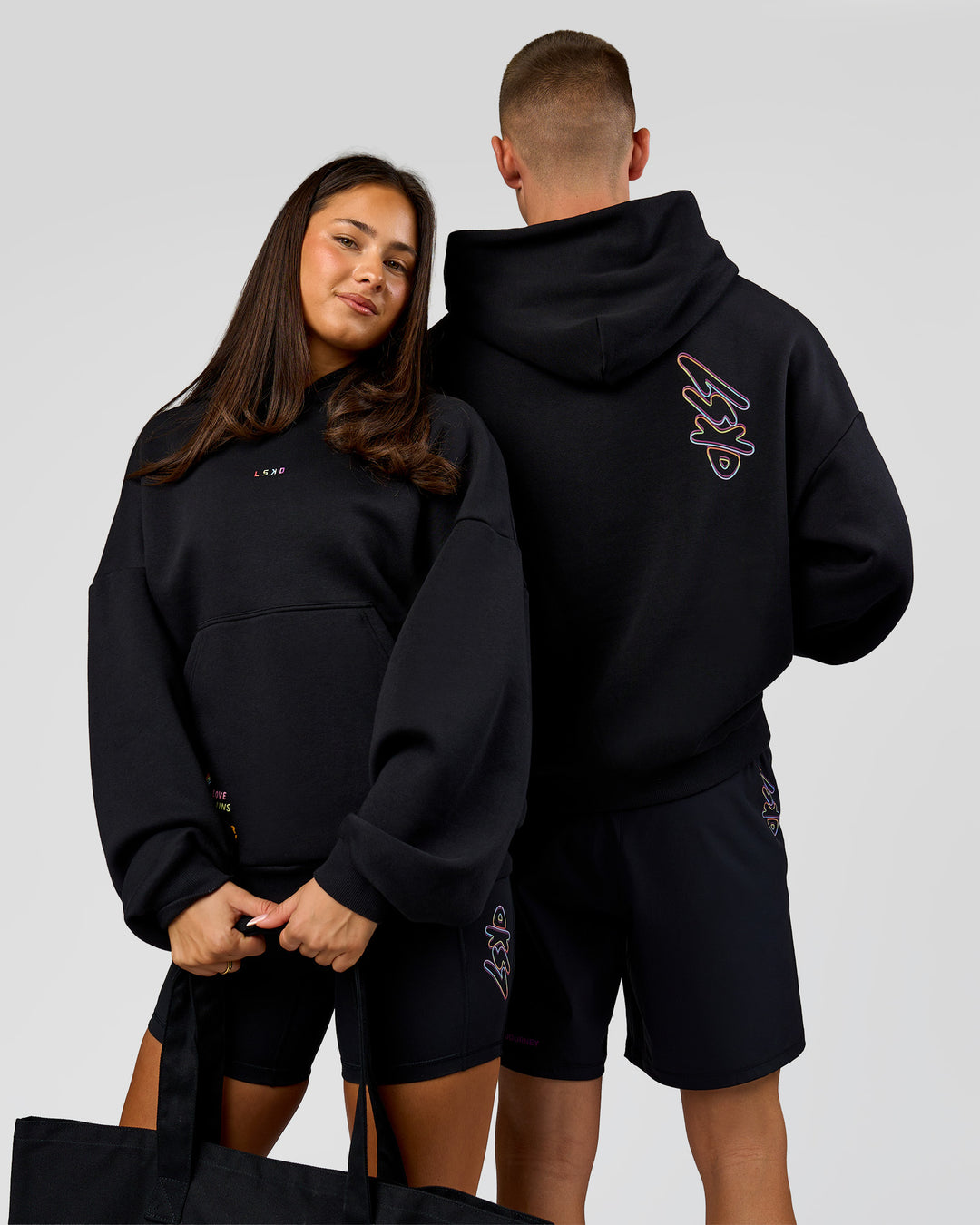 Duo wearing Pride Sticker Boxy Hoodie - Black | Model:Bianca | Size:XS | Model:Albert | Size:M - view 4