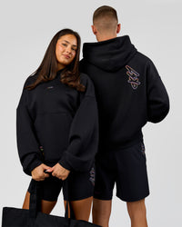 Duo wearing Pride Sticker Boxy Hoodie - Black | Model:Bianca | Size:XS | Model:Albert | Size:M | Thumbnail Index: 3