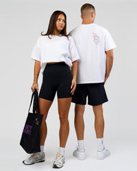 Duo wearing Pride Sticker Boxy Tee - White | Model:Bianca | Size:XS | Model:Albert | Size:M | Thumbnail Index: 0