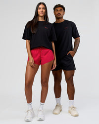 Duo wearing RUN CLUB FLXCotton Tee Oversize - Black-Scarlet | Model:Xav | Size:L | Model:Rhiley | Size:XS | Thumbnail Index: 8