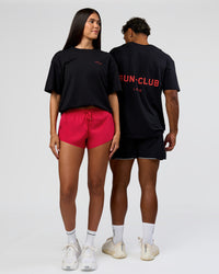 Duo wearing RUN CLUB FLXCotton Tee Oversize - Black-Scarlet | Model:Xav | Size:L | Model:Rhiley | Size:XS | Thumbnail Index: 0
