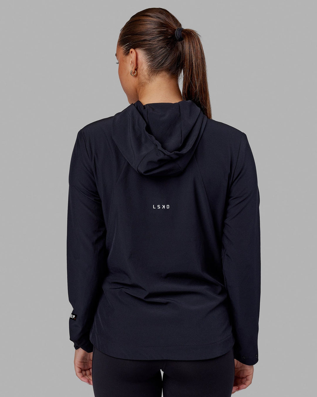 Woman wearing Fitstop Womens Functional Training Jacket - Black - view 2
