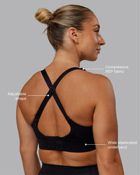 Woman wearing Accelerate Sports Bra in Black | Size:S | Thumbnail Index: 1