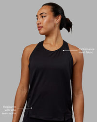 Woman wearing Pace Running Tank - Black | Thumbnail Index: 1
