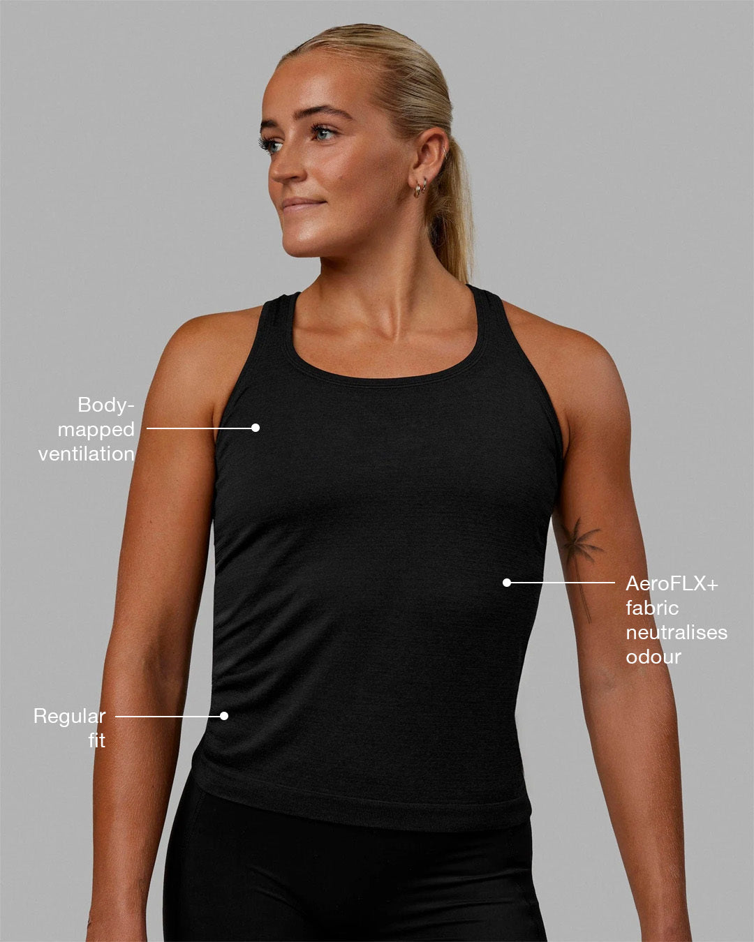 Woman wearing AeroFLX+ Seamless Tank - Black Marl - view 2