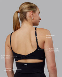 Woman wearing Twist Shelf Bra Tank - Black | Thumbnail Index: 1