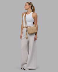 Woman wearing Go-To Shoulder Bag - Oat Milk | Thumbnail Index: 9