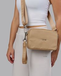 Woman wearing Go-To Shoulder Bag - Oat Milk | Thumbnail Index: 0