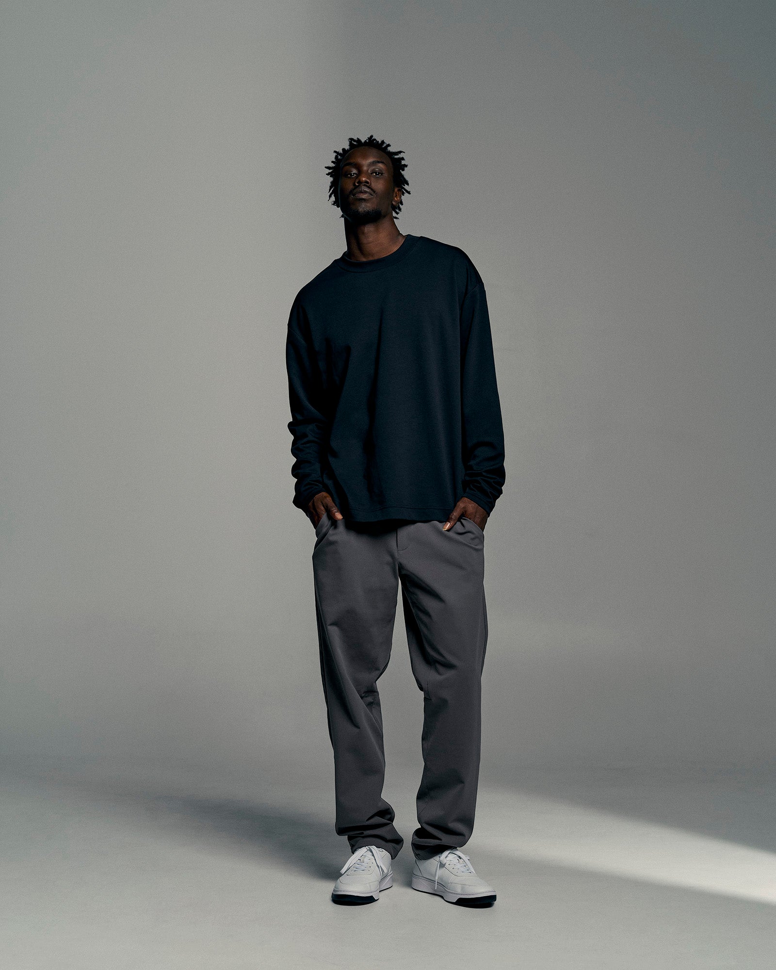 Man wearing All Day ZeroCrease™  Regular Pant - Dark Storm | Model:Okello | Size:L