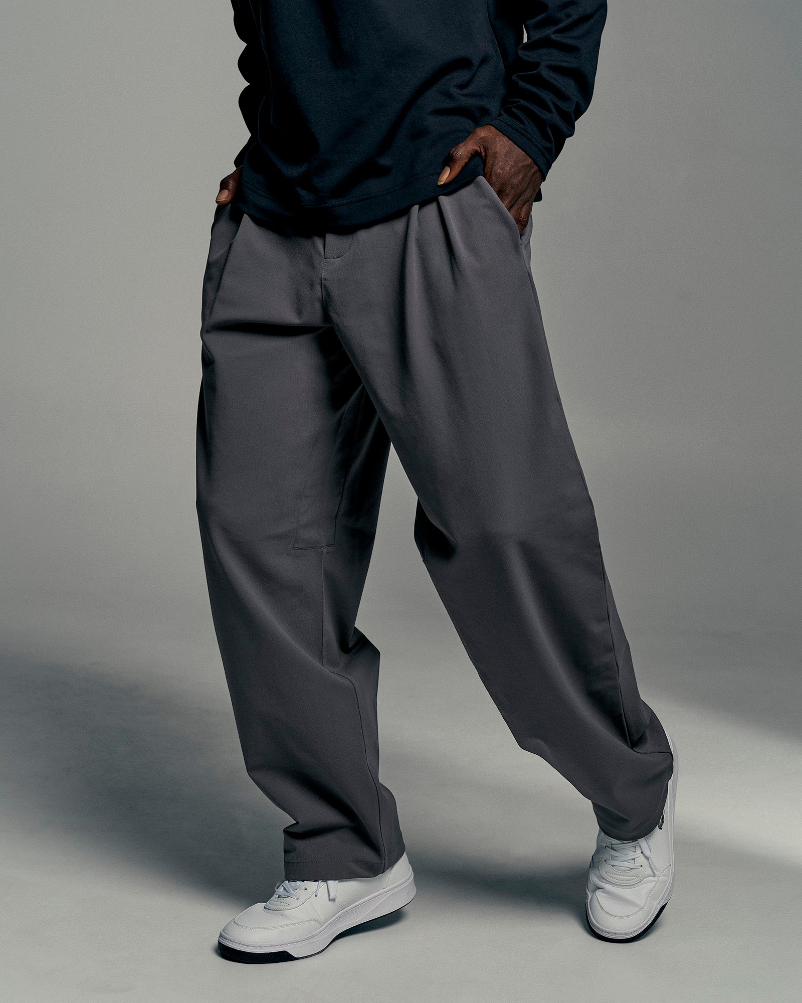 Man wearing All Day ZeroCrease™ Wide Leg Pant - Dark Storm | Model:Okello | Size:L