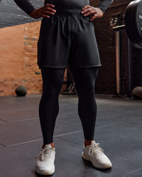 Man wearing BaseTech 26" Leggings - Black | Model:Paris | Size:L | Thumbnail Index: 2