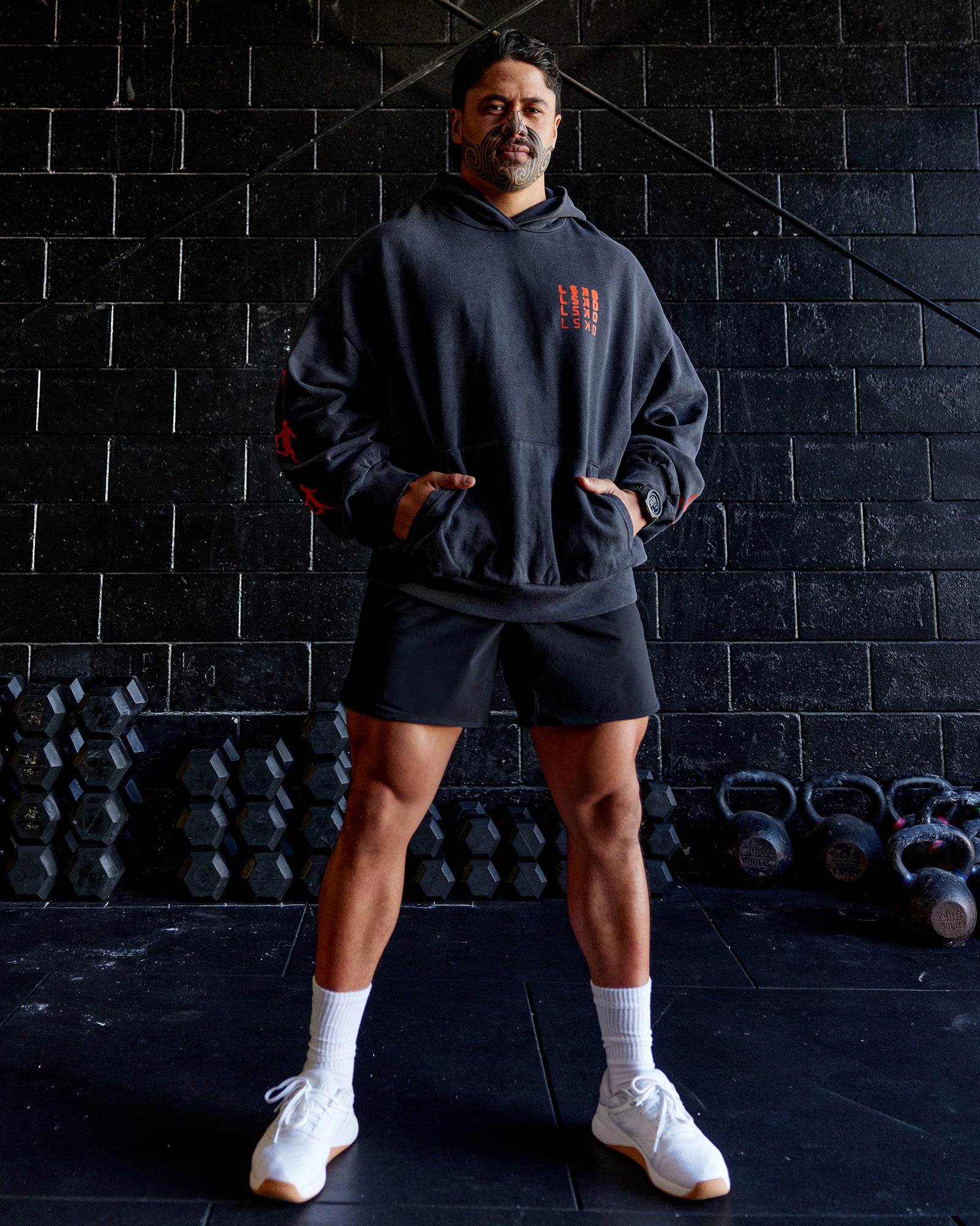 Man wearing Journey Washed Unisex Oversize Hoodie - Black-Ultra Orange | Model:Hiko | Size:L