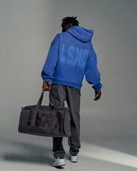 Man wearing Memory In Motion Ultra Heavyweight Washed Hoodie - Electric Indigo Washed | Model:Okello | Size:L | Thumbnail Index: 6