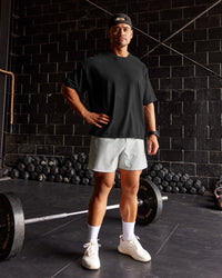 Man wearing Oversized Heavyweight Boxed Tee - Washed Black | Model:Moses | Size:L | Thumbnail Index: 0