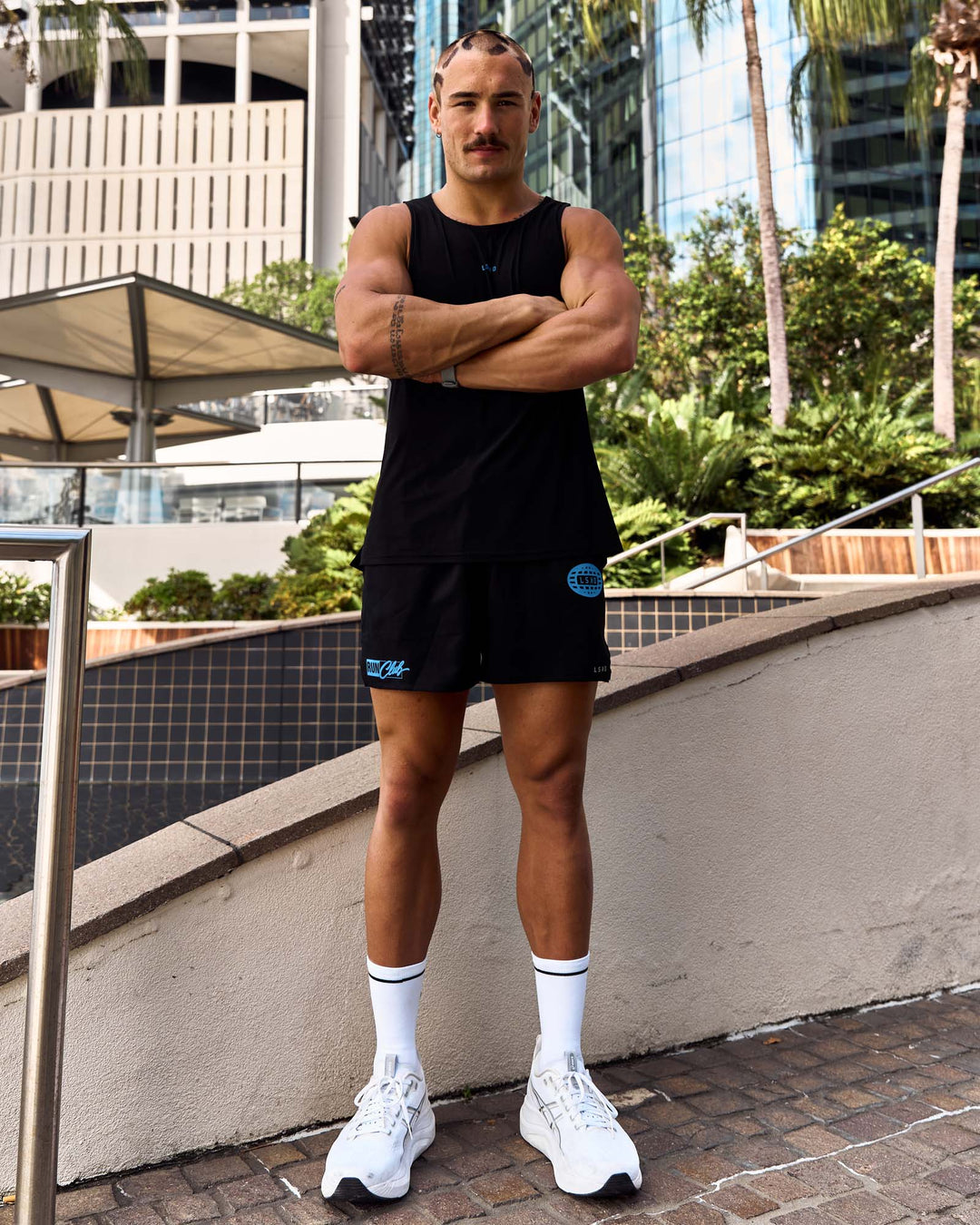Man wearing Pace 5" Lined Running Short - Black-Palace Blue | Model:Cooper | Size:L - view 4