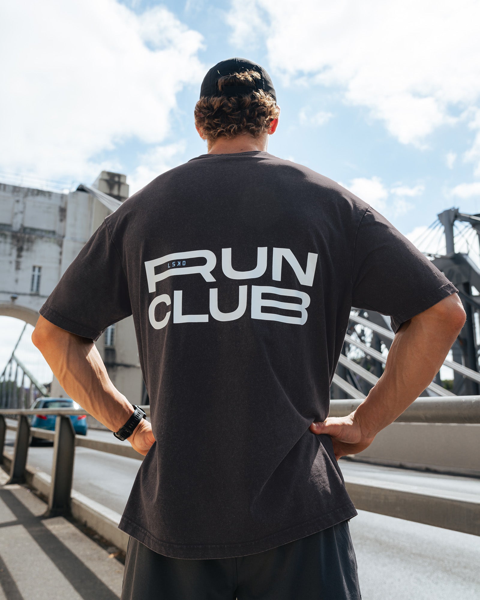 Man wearing Runner's FLXCotton Oversized Tee - Black Washed-White | Model:Kyal | Size:L