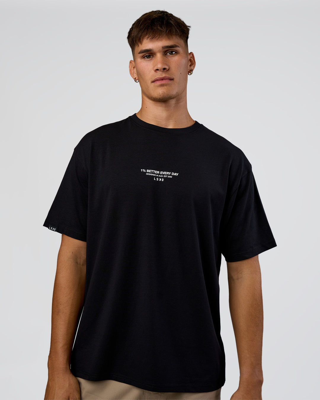 Man wearing 1% Better Every Day EST FLXCotton Oversized Tee - Black | Model:Jackson | Size:L - view 2