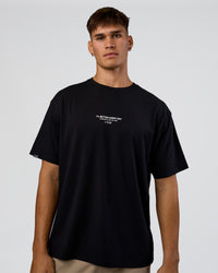 Man wearing 1% Better Every Day EST FLXCotton Oversized Tee - Black | Model:Jackson | Size:L | Thumbnail Index: 1